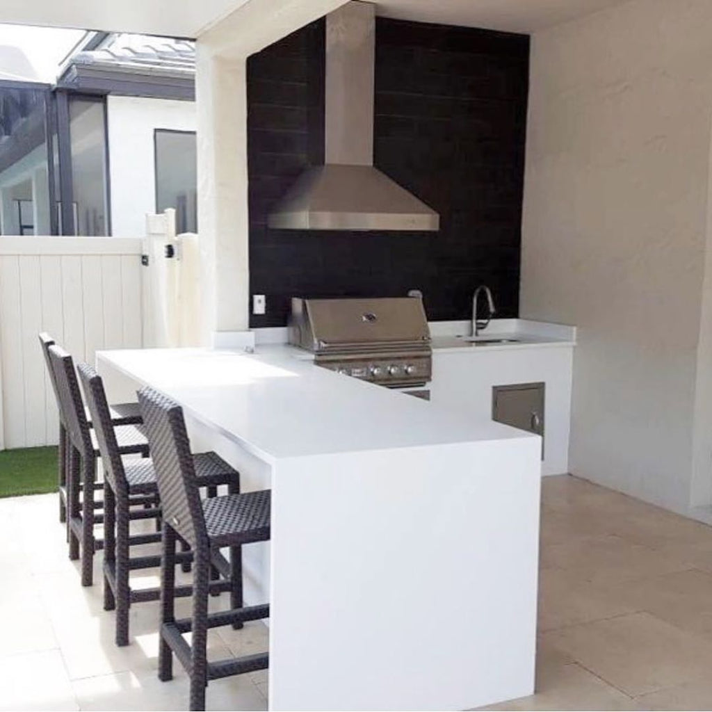 Clean and Precise, White Waterfall Counters, Summer Living in a Compact Space