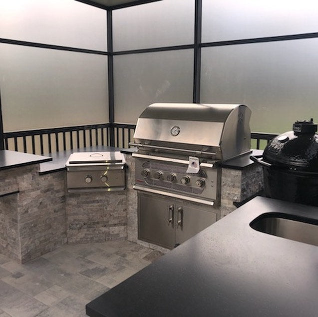 Dramatic and Sleek, Silver Travertine Kitchen, Absolute Black Granite, Privacy Glass, Bold Outdoor Living in Florida