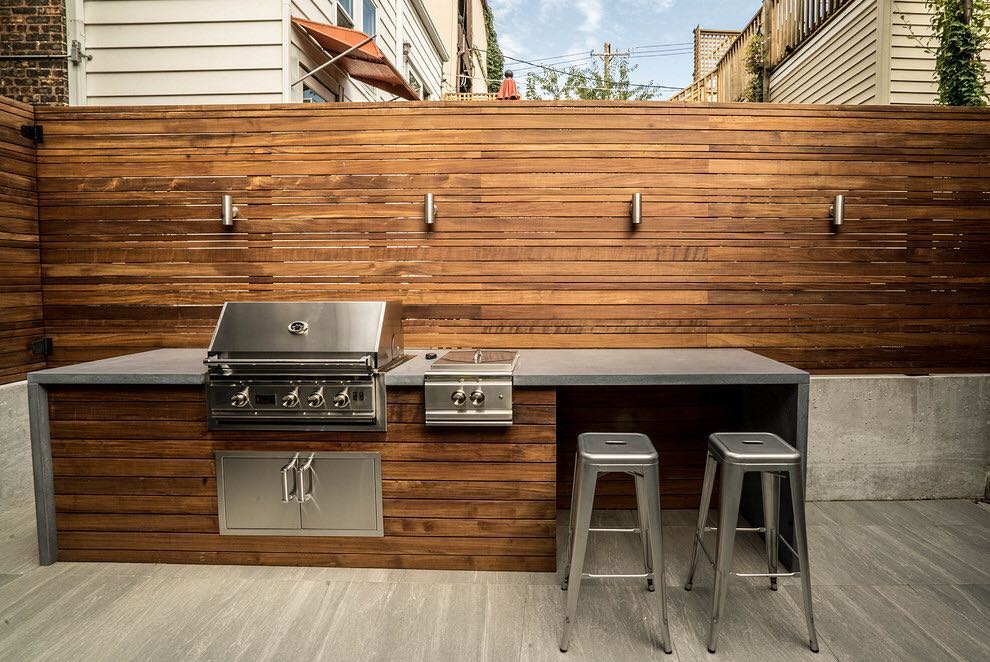 Warm & Modern Coastal Grilling Hideaway with Gorgeous Wood Slatting and Waterfall Counters