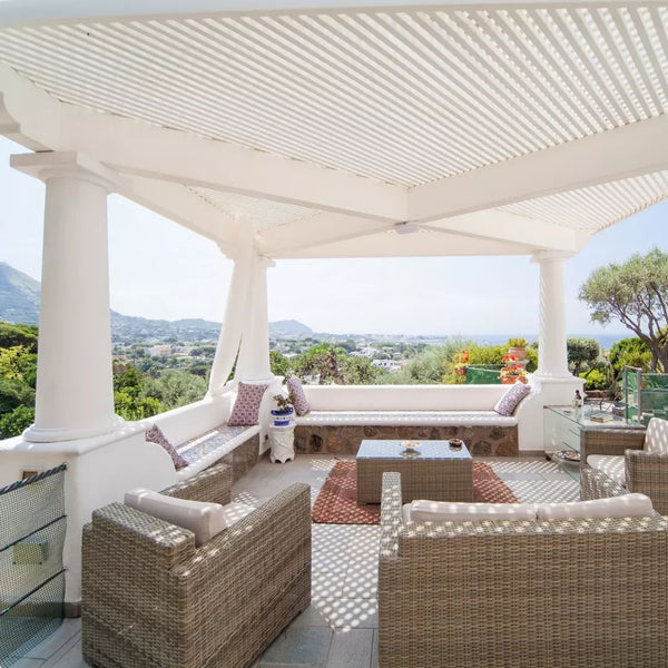 A Mediterranean-Themed Outdoor Veranda with Coastline Views