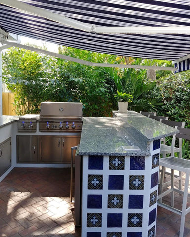 Get the Mediterranean look for your backyard with a Mediterranean-Style, Custom Tile, Blue Granite & a Classic Retractable Awning