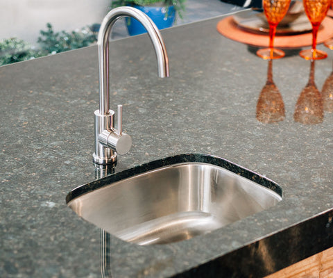 Add a sink to your outdoor space to keep things clean and tidy