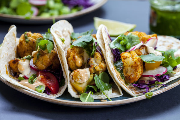 Grilled Cauliflower Tacos with Mango Slaw & Avocado Crema