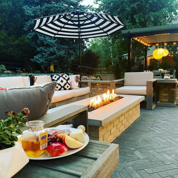 Outdoor seating area with custom furniture and fire pit
